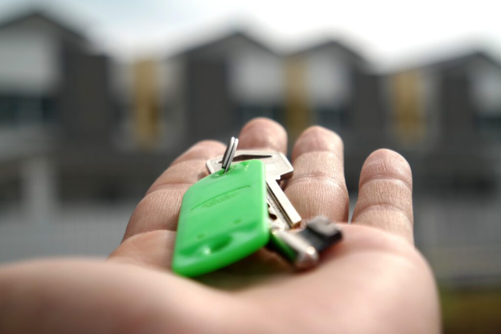 open hand holding house keys