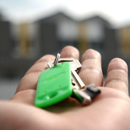 open hand holding house keys