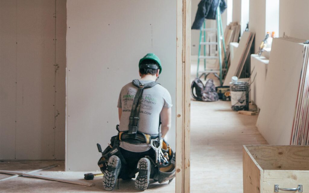 Construction worker with tool belt on a job
