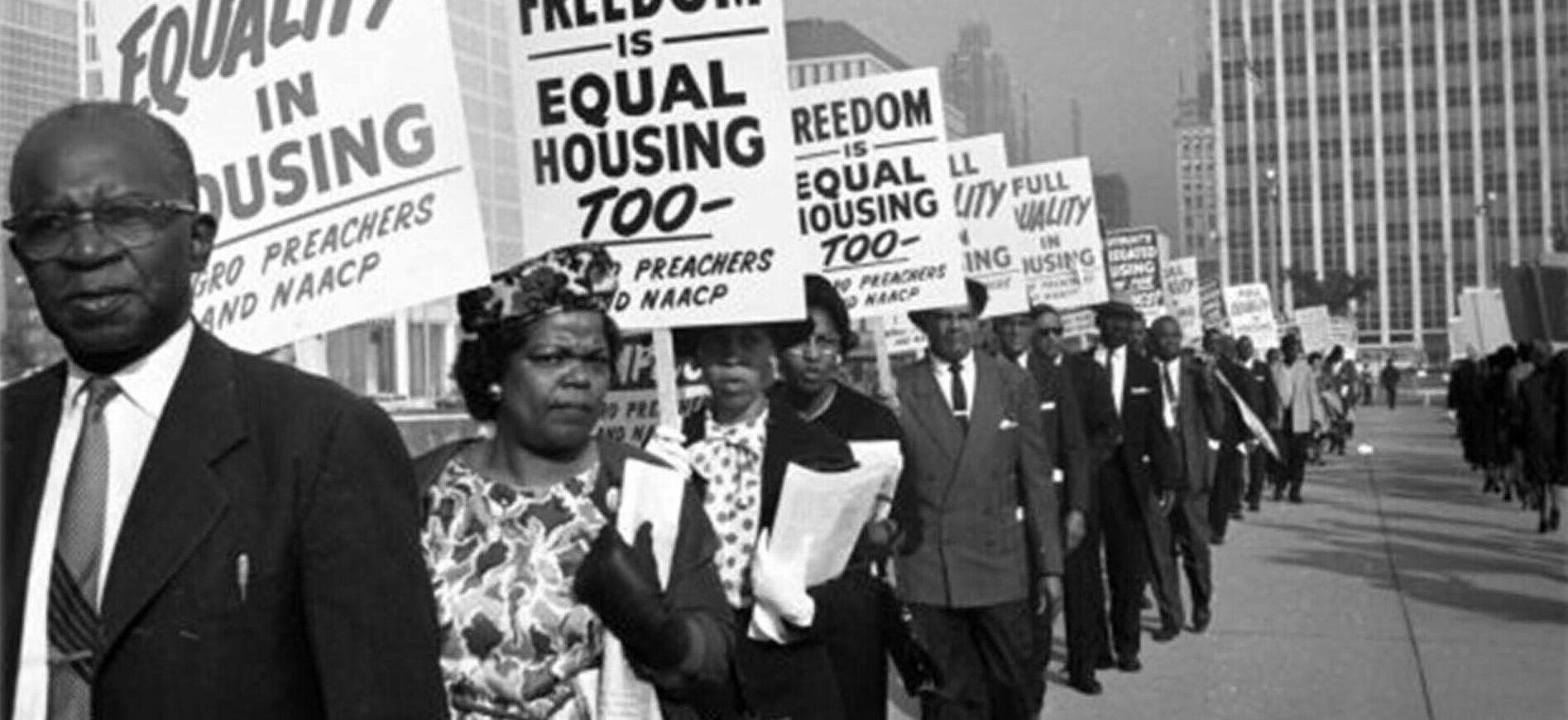 Historic photo of protesters advocating for equal housing