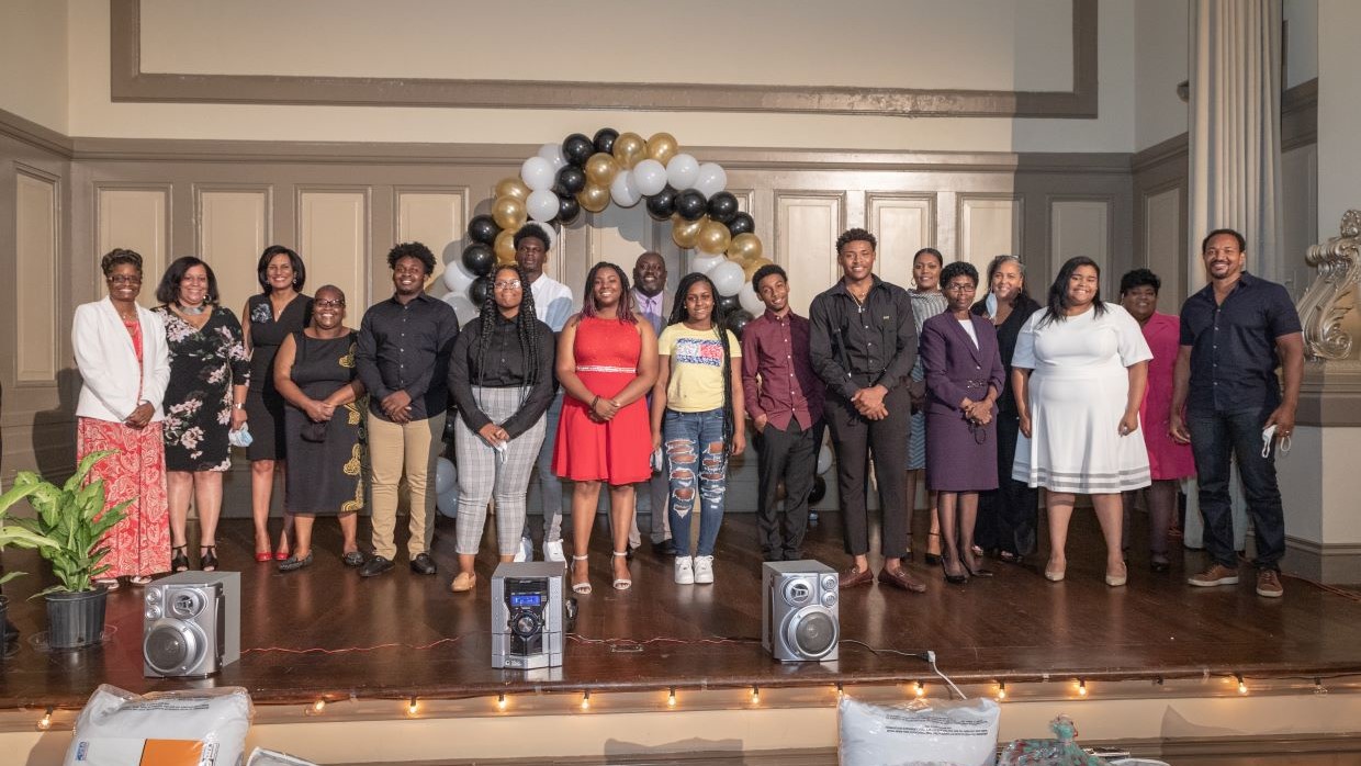 2020 scholarship recipients and presenters on stage