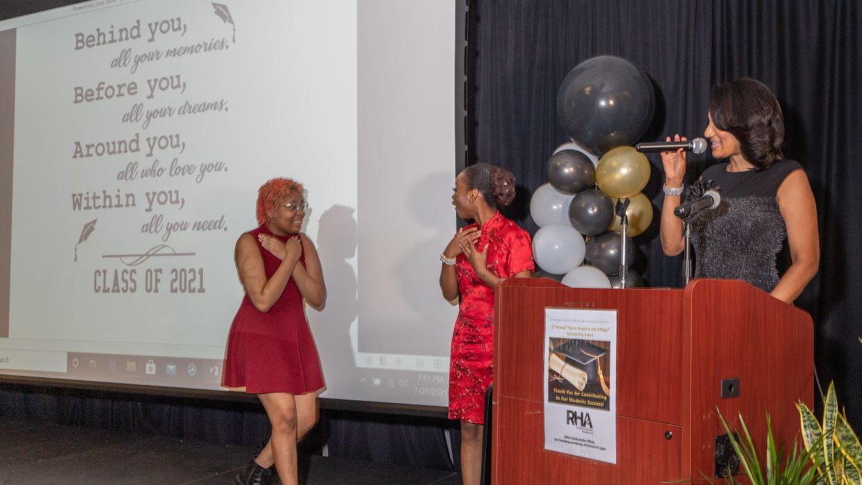 Two girls happy on stage 2021 open house event