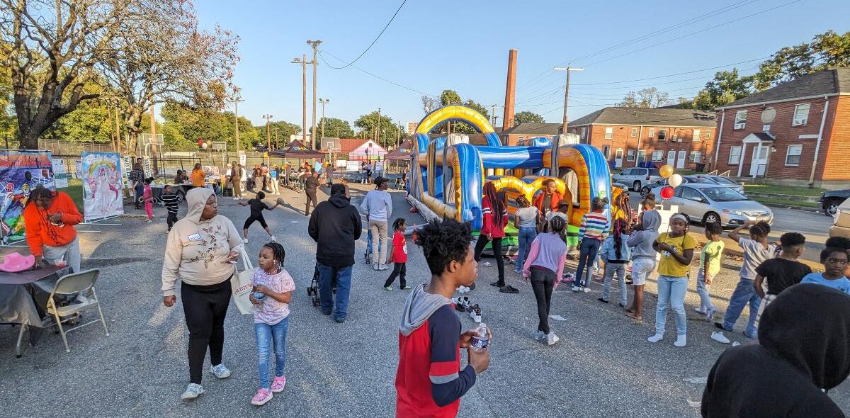 A crowd of residents and community members celebrating at the Jackson Ward Community Plan final event