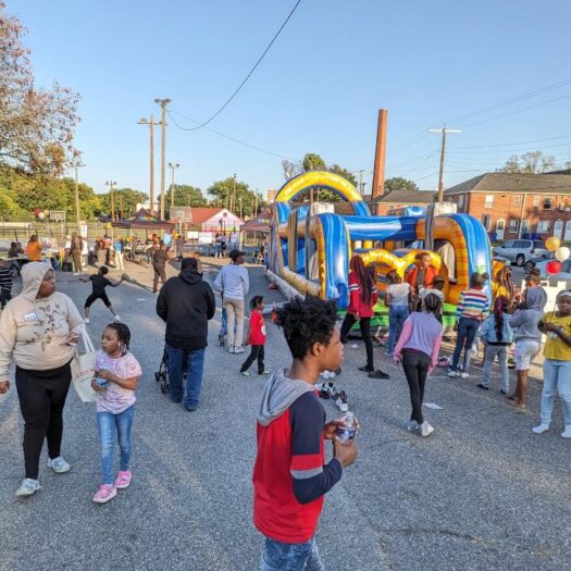 A crowd of residents and community members celebrating at the Jackson Ward Community Plan final event