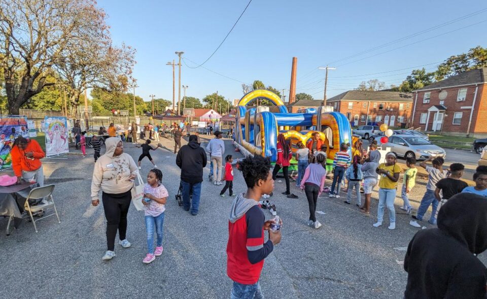 A crowd of residents and community members celebrating at the Jackson Ward Community Plan final event