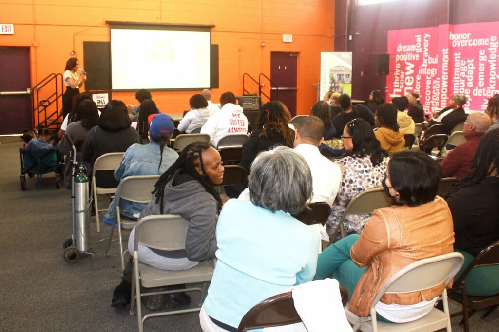 Angela Fountain presenting at a ComeHome town hall