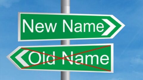 A street sign with the labels "New Name" and "Old Name" (crossed out)