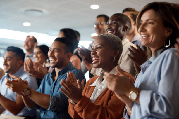 Group of individuals clapping