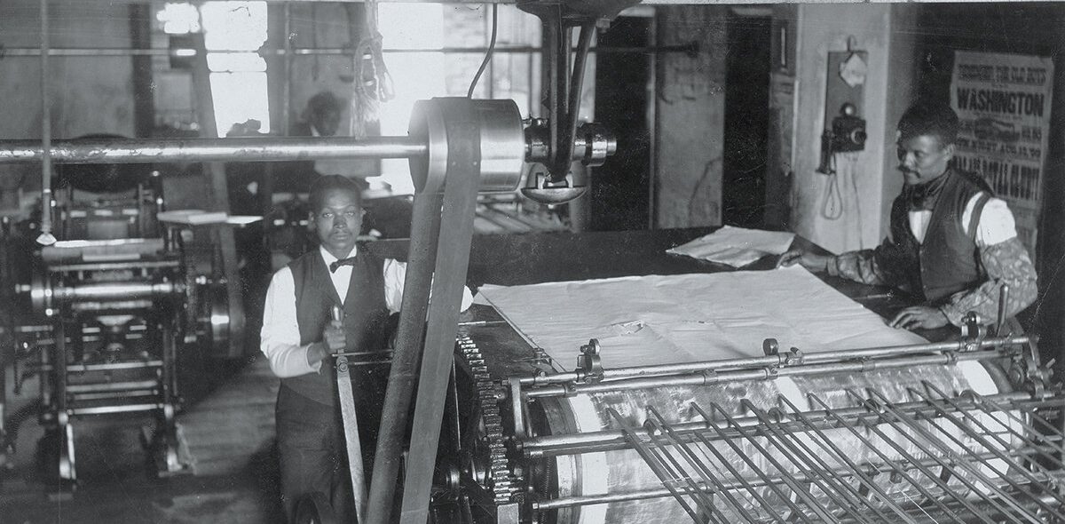 Two black publishers in the press room of the Richmond Planet, 1899