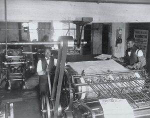 Two black publishers in the press room of the Richmond Planet, 1899