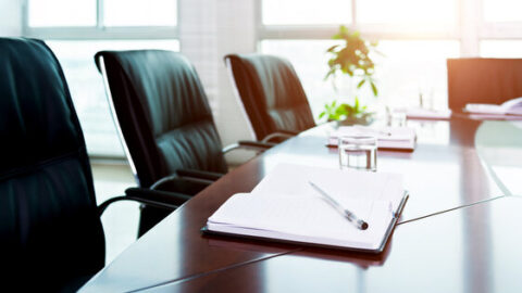 Office chairs around a boardroom table